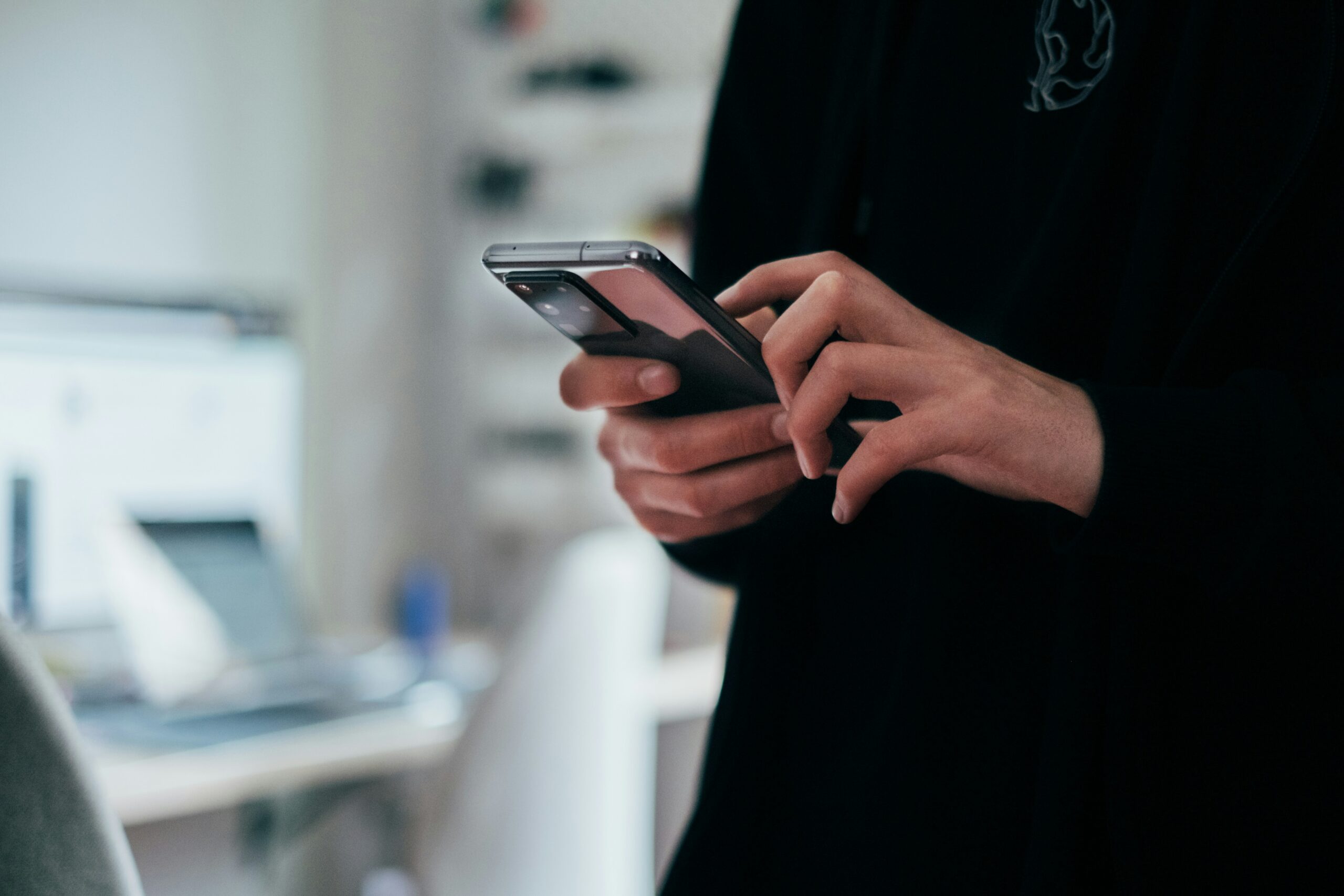 An image of a woman faxing from her phone.